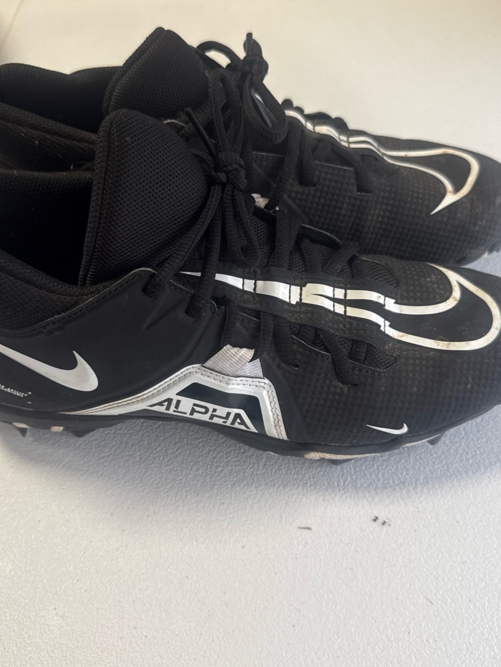 Nike Men’s Black and White Alpha Athletic Cleats